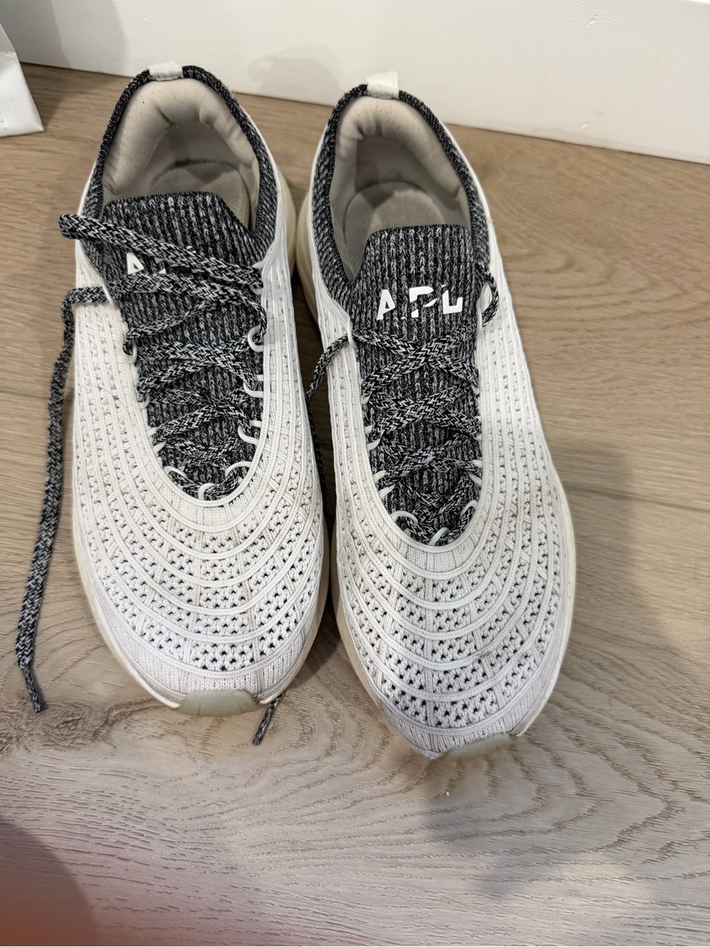 APL Knit Slip-On Sneakers in White and Black Trim zip line